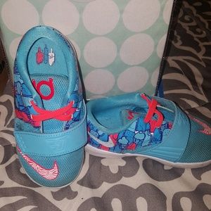 Worn aqua blue and orange KDs Nike kids  size 7c